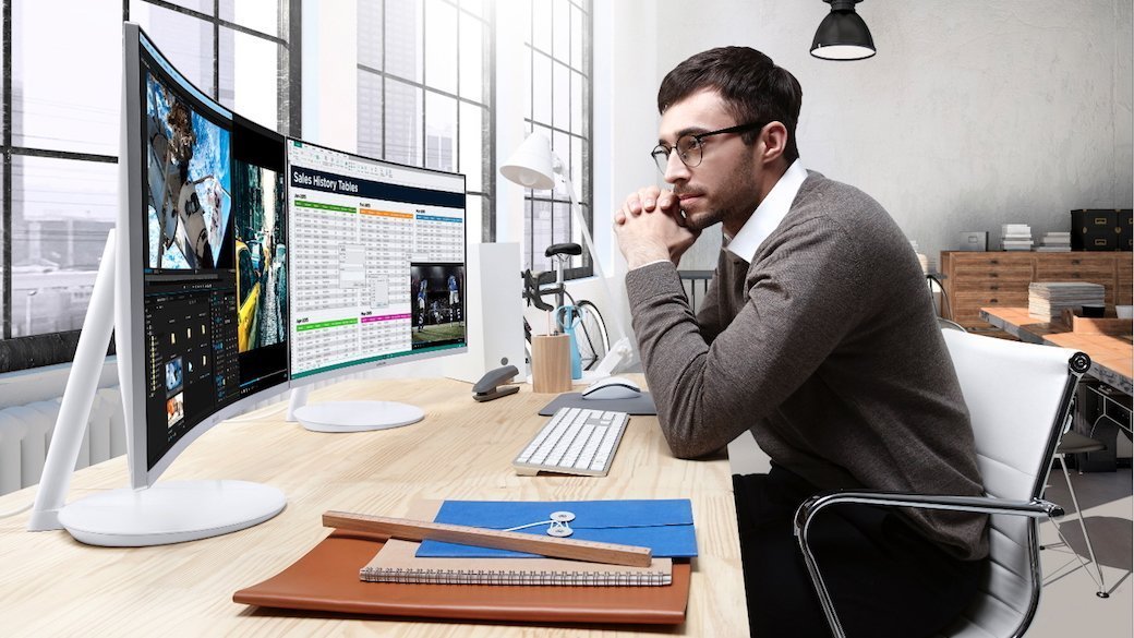 Person sitting at a desk in front of computer