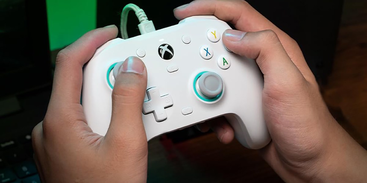 Hands holding GameSir G7 SE Wired Controller