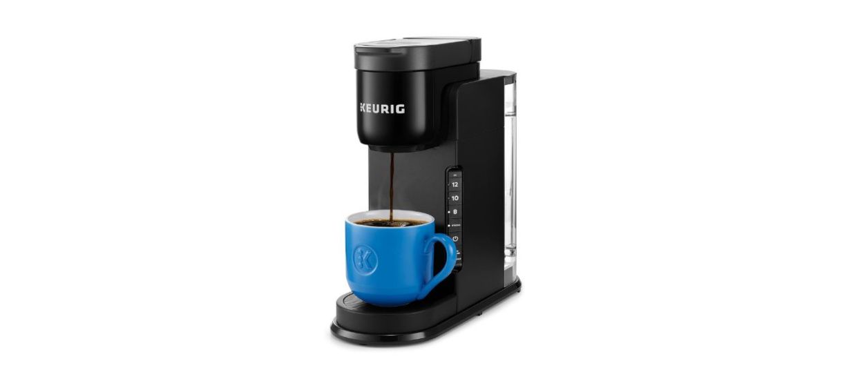 Keurig K-Express Coffee Maker pouring coffee into a cup Keurig K-Express Coffee Maker pouring coffee into a cup