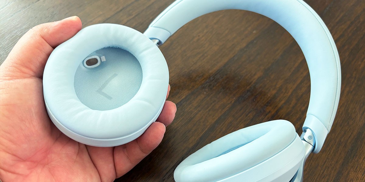 Hand holding Soundcore Space Ones earpiece Hand holding Soundcore Space Ones earpiece