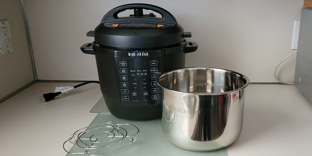 Instant Pot RIO on counter with stainless steel bowl in front