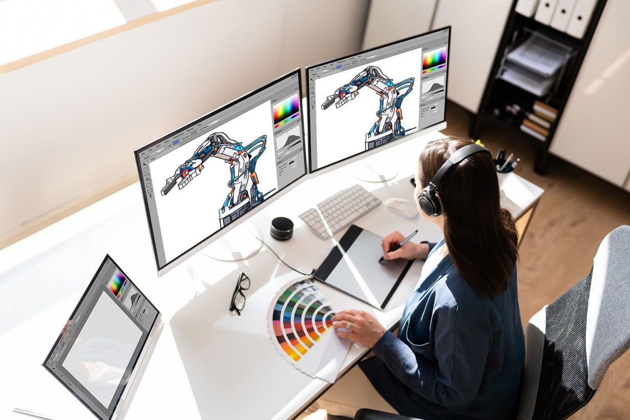 graphic artist with two monitors