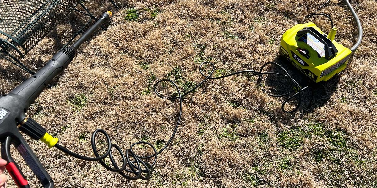 Ryobi 1800 psi Pressure Washer on lawn with closeup image of wand